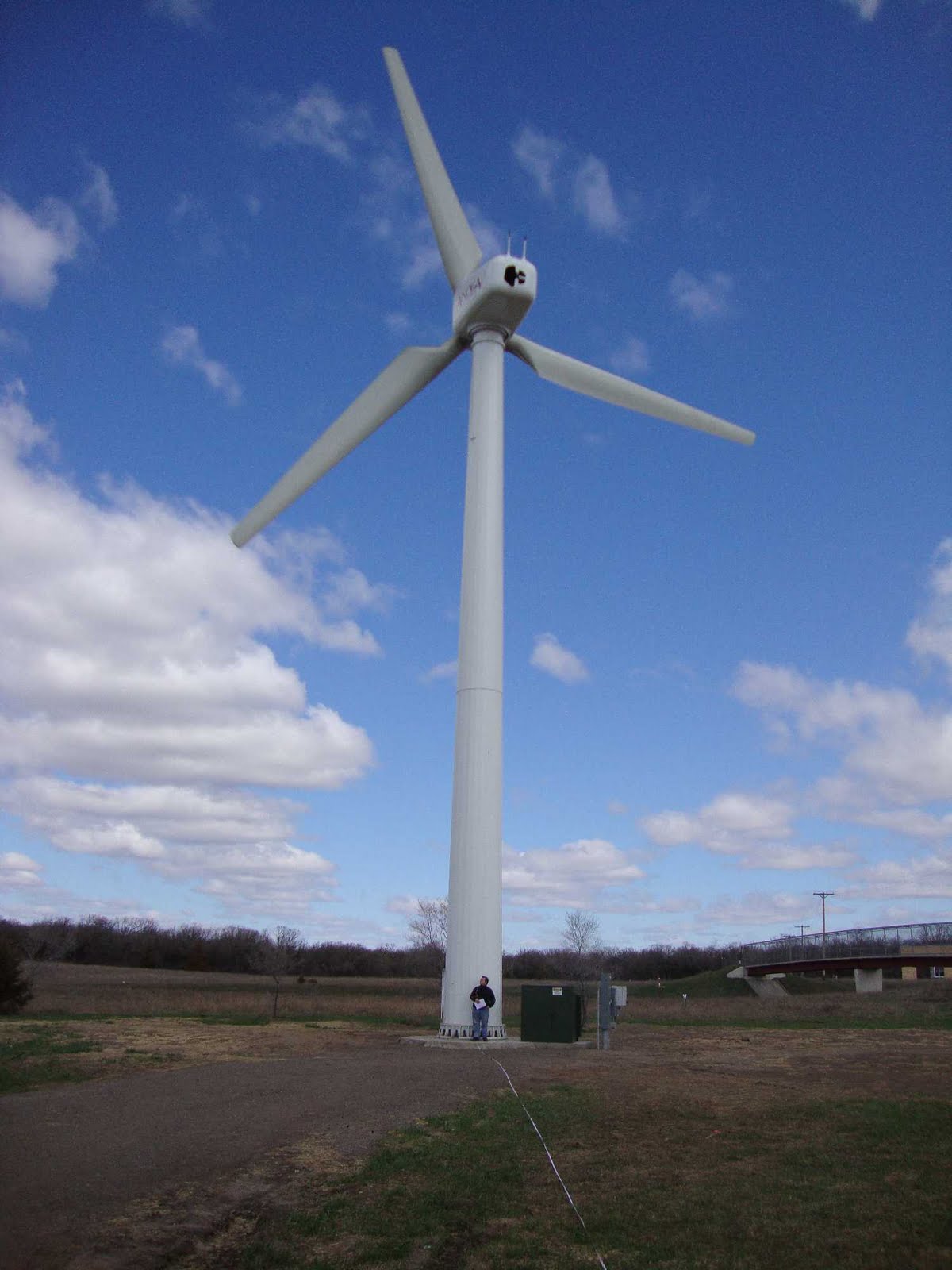 Scale demo: person in front of wind turbine